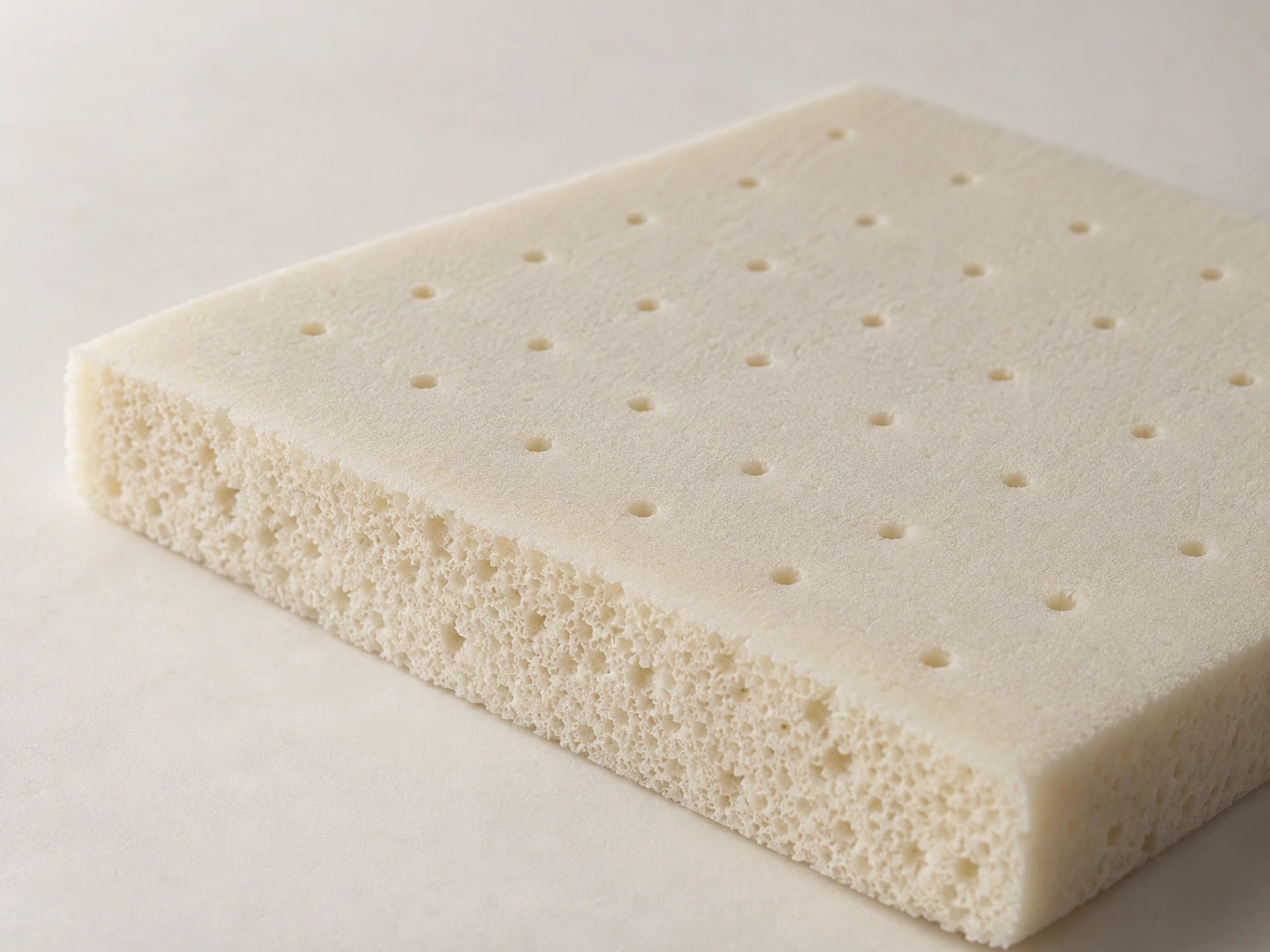 Material study of a single latex foam panel with pinholes and a porous cut edge